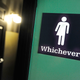 A gender-neutral sign is posted outside a bathroom at Oval Park Grill in Durham, N.C., on May 11, 2016.
Sara D. Davis/Getty Images
